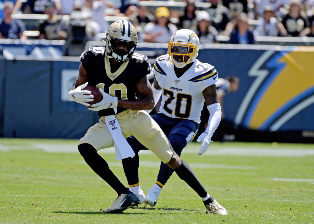 Aug 18, 2019; Carson, CA, USA; New Orleans Saints wide receiver Tre'Quan Smith (10) carries the ball past Los Angeles Chargers defensive back Desmond King (20) during the first half at Dignity Health Sports Park. Mandatory Credit: Kirby Lee-USA TODAY