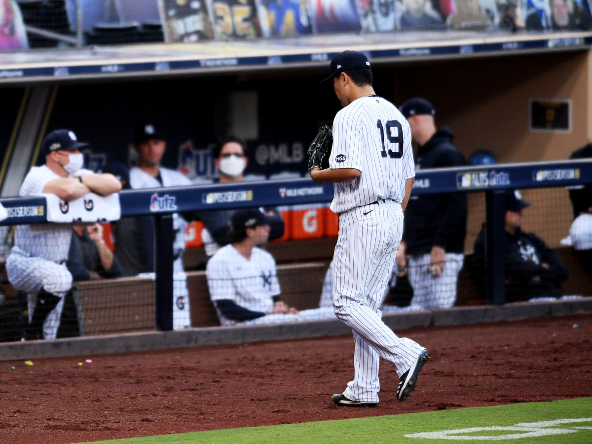 Oct 7, 2020; San Diego, California, USA; New York Yankees starting pitcher Masahiro Tanaka (19) walks to the dugout after being relieved in the fifth inning against the Tampa Bay Rays during game three of the 2020 ALDS at Petco Park.