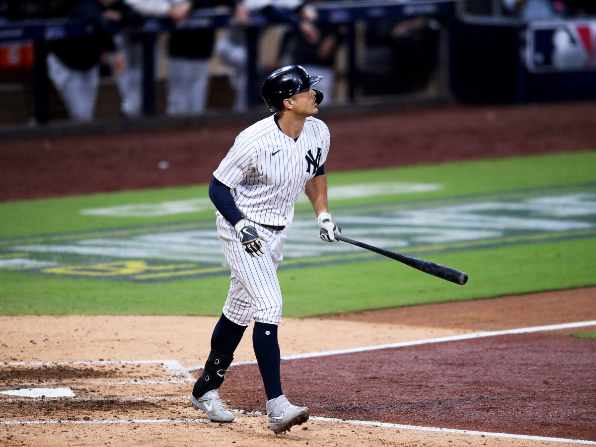 Oct 7, 2020; San Diego, California, USA; New York Yankees designated hitter Giancarlo Stanton (27) hits a two run home run against the Tampa Bay Rays in the eighth inning during game three of the 2020 ALDS at Petco Park.