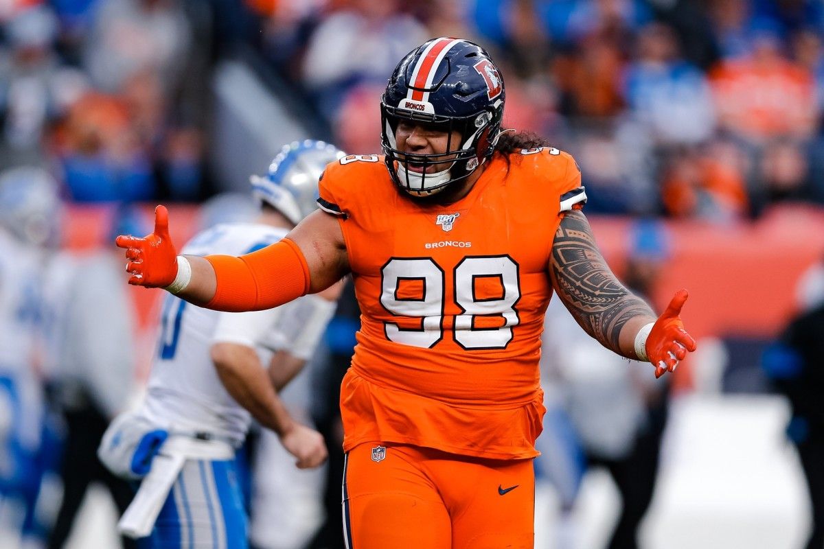 Denver Broncos nose tackle Mike Purcell (98) reacts after a play against the Detroit Lions in the third quarter at Empower Field at Mile High.