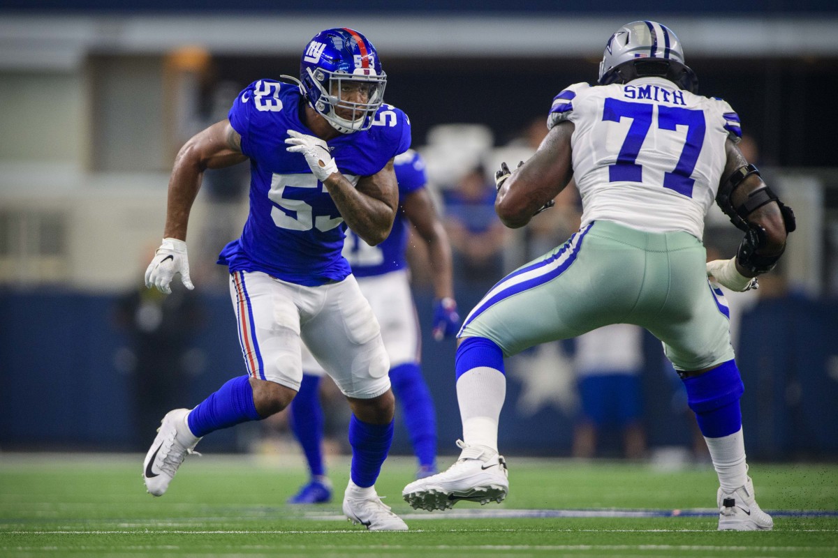 Sep 8, 2019; Arlington, TX, USA; New York Giants linebacker Oshane Ximines (53) and Dallas Cowboys offensive tackle Tyron Smith (77) in action during the game between the Cowboys and the Giants at AT&T Stadium.
