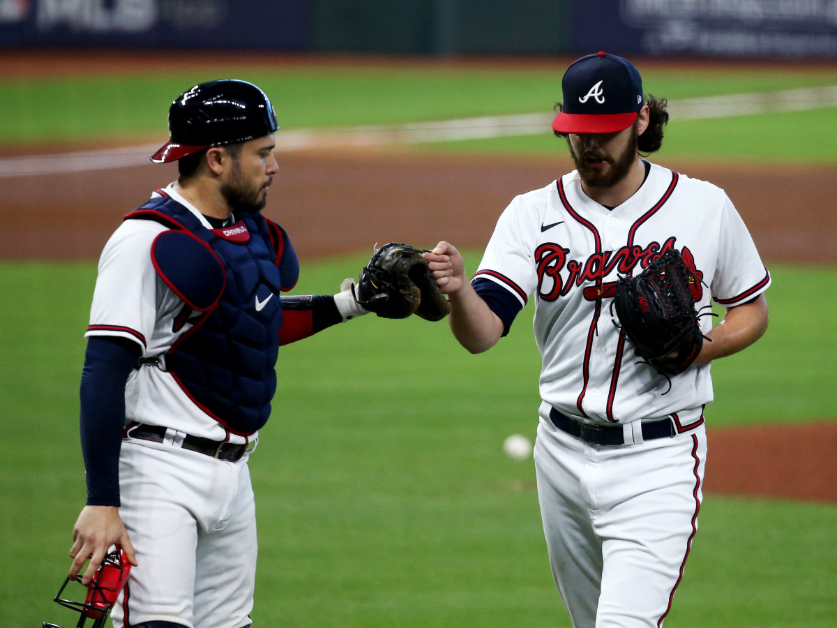Oct 7, 2020; Houston, Texas, USA; Atlanta Braves starting pitcher Ian Anderson (48) and catcher Travis d'Arnaud (16) react in the second inning against the Miami Marlins during game two of the 2020 NLDS at Minute Maid Park.