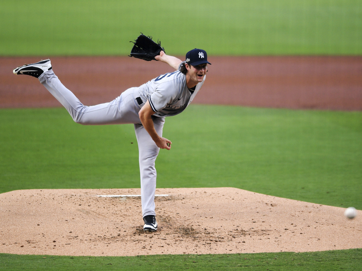 Oct 5, 2020; San Diego, California, USA; New York Yankees starting pitcher Gerrit Cole (45) pitches against the Tampa Bay Rays during the first inning in game one of the 2020 ALDS at Petco Park.