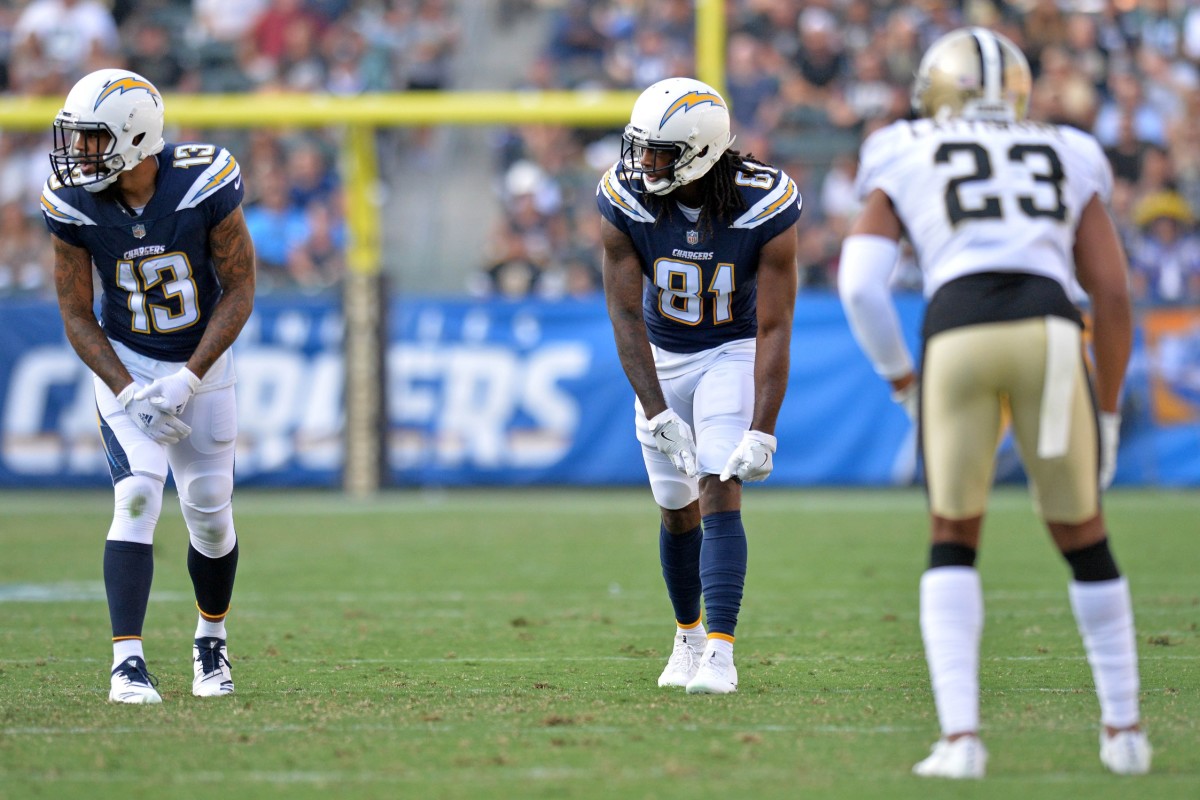 Aug 25, 2018; Carson, CA, USA; Los Angeles Chargers wide receiver Keenan Allen (13) and wide receiver Mike Williams (81) at the line as New Orleans Saints cornerback Marshon Lattimore (23) defends at StubHub Center. Mandatory Credit: Jake Roth-USA TODAY