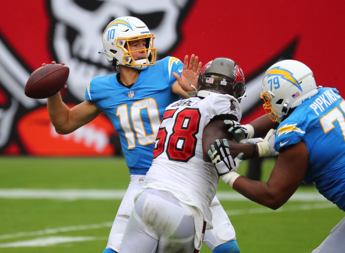 Oct 4, 2020; Tampa, Florida, USA; Los Angeles Chargers quarterback Justin Herbert (10) throws a pass Tampa Bay Buccaneers in the third quarter of a NFL game at Raymond James Stadium. Mandatory Credit: Kim Klement-USA TODAY Sports