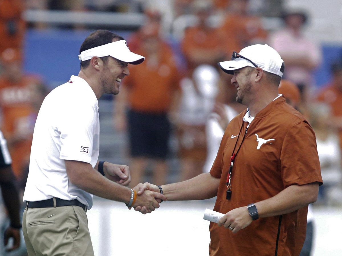 Lincoln Riley (left) greets Tom Herman before the 2019 Red River Showdown.