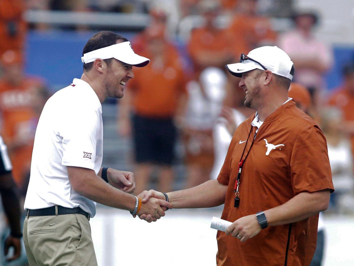 Lincoln Riley (left) greets Tom Herman before the 2019 Red River Showdown.