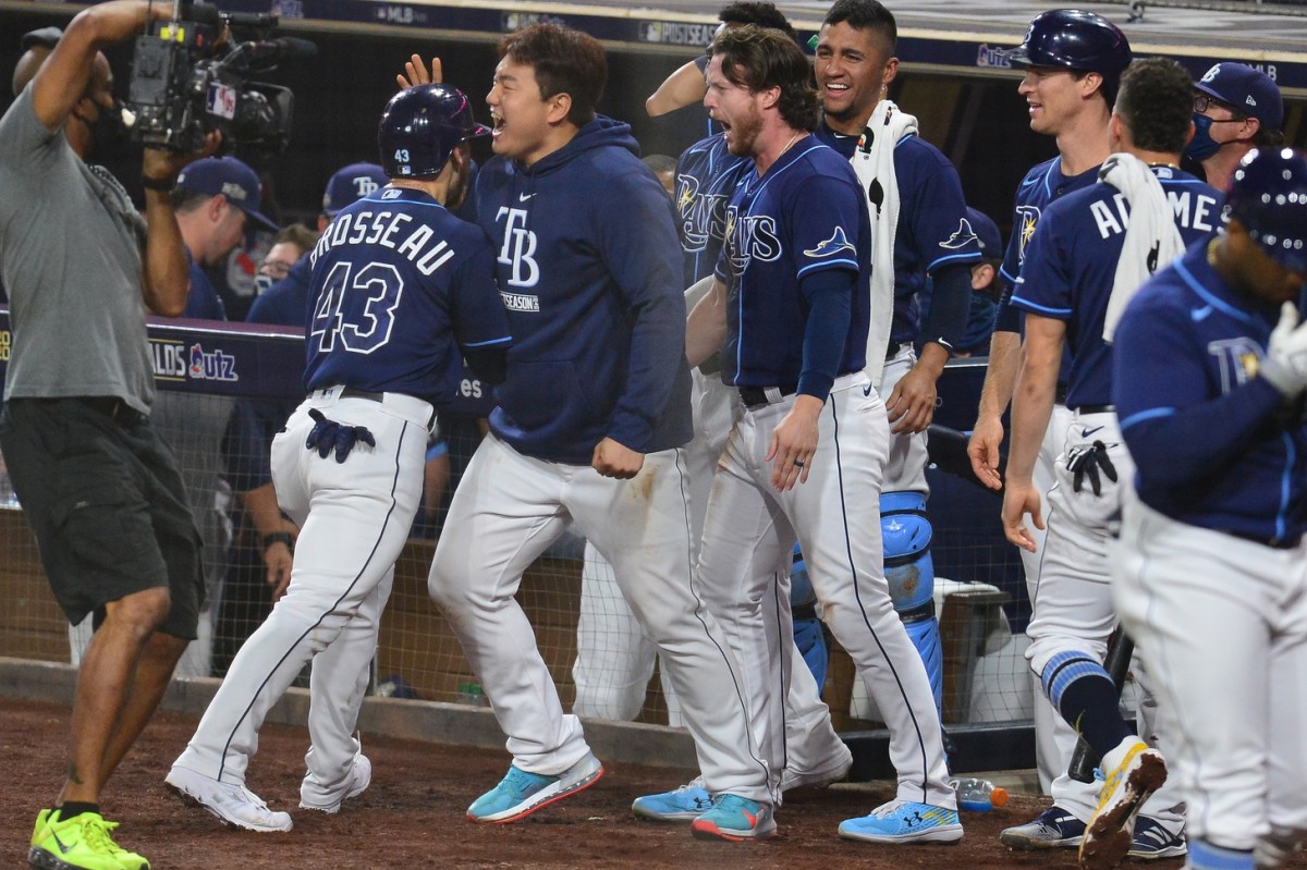 Teammates swarm Tampa Bay's Mike Brosseau after his eighth-inning homer gave the Rays the lead in Game 5. (USA TODAY Sports)