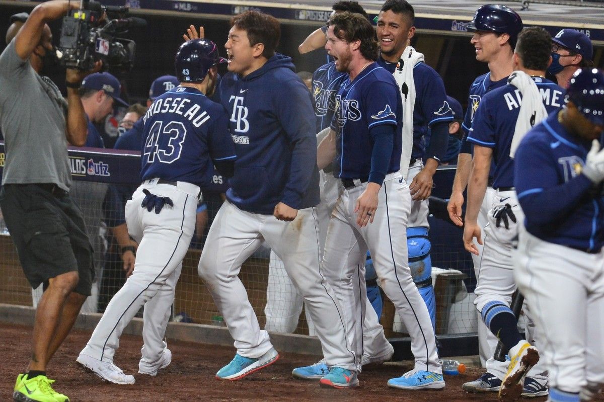 Teammates swarm Tampa Bay's Mike Brosseau after his eighth-inning homer gave the Rays the lead in Game 5. (USA TODAY Sports)