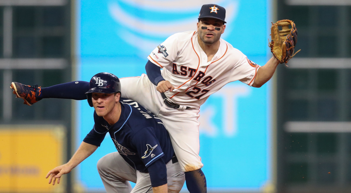 Tampa Bay Rays third baseman Joey Wendle (18) is forced out as Houston Astros second baseman Jose Altuve (27) throws onto first base in the ninth inning in game two of the 2019 ALDS