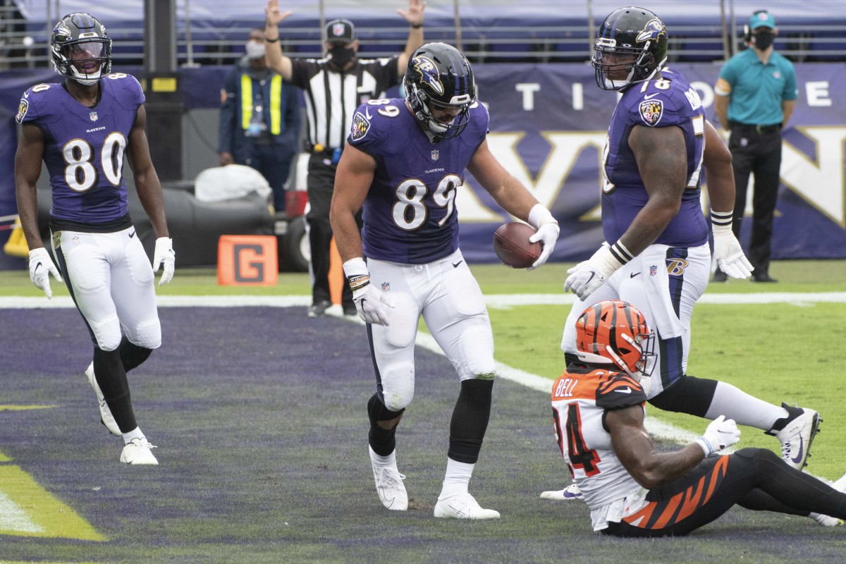 Oct 11, 2020; Baltimore, Maryland, USA; Baltimore Ravens tight end Mark Andrews (89) reacts after scoring a first quarter touchdown as Cincinnati Bengals strong safety Vonn Bell (24) looks on at M&T Bank Stadium. Mandatory Credit: Tommy Gilligan-USA TODAY Sports