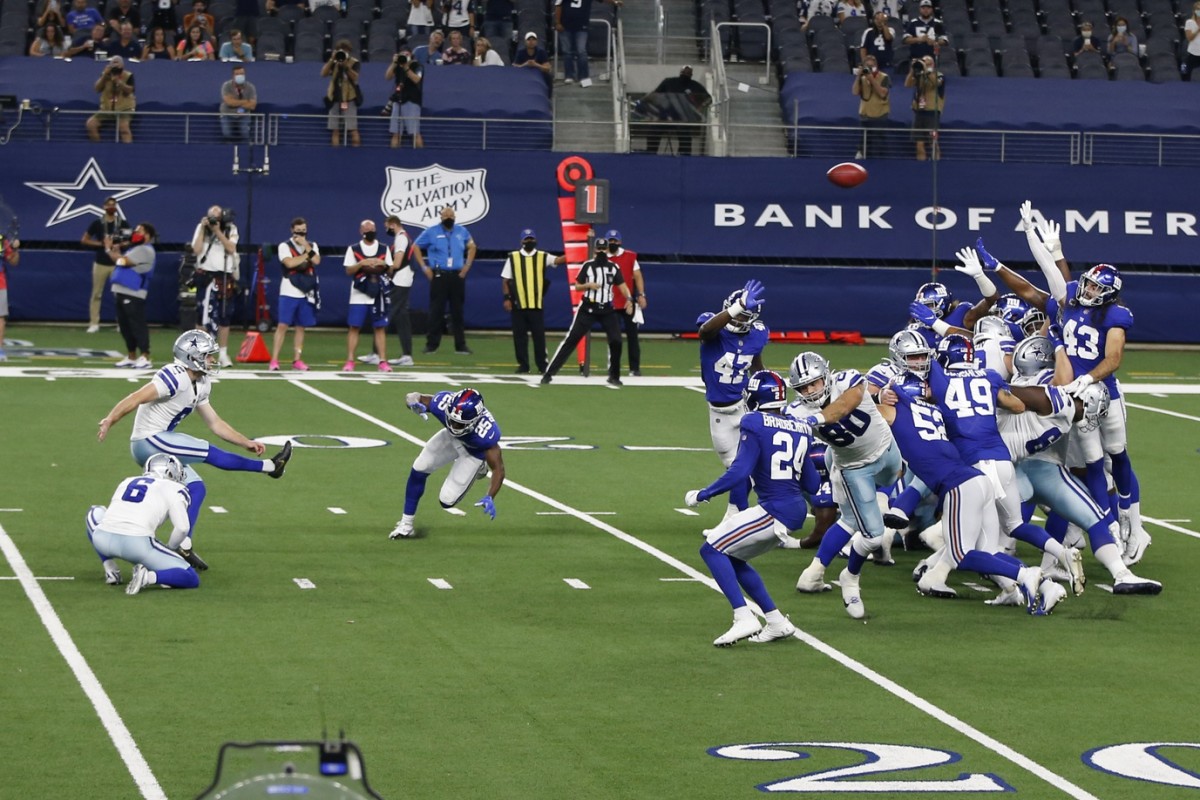 Oct 11, 2020; Arlington, Texas, USA; Dallas Cowboys kicker Greg Zuerlein (2) kicks the game-winning field goal with three seconds left in the fourth quarter against the New York Giants at AT&T Stadium.