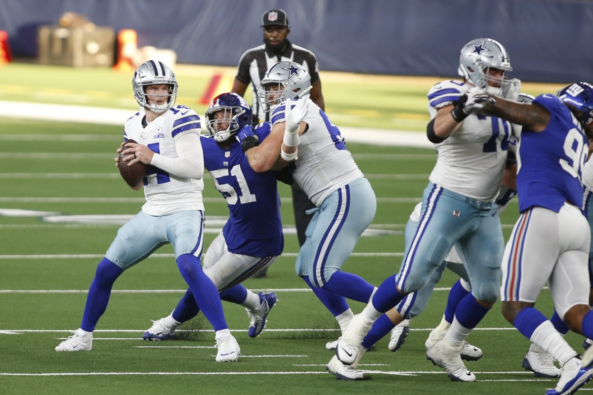 Oct 11, 2020; Arlington, Texas, USA; Dallas Cowboys quarterback Andy Dalton (14) looks to throw from the pocket in the fourth quarter against the New York Giants at AT&T Stadium.