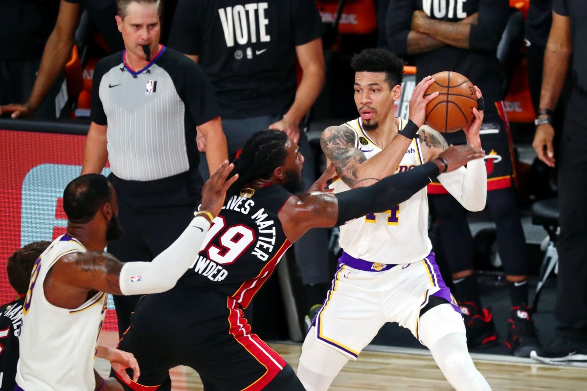 Lake Buena Vista, Florida, USA; Los Angeles Lakers guard Danny Green (14) holds the ball while defended by Miami Heat forward Jae Crowder (99) during the third quarter in game six of the 2020 NBA Finals at AdventHealth Arena. (Kim Klement-USA TODAY Sports)