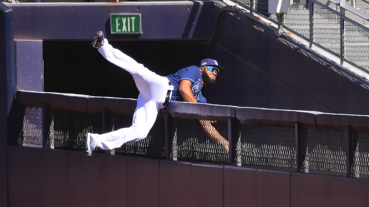 Tampa Bay Rays right fielder Manuel Margot (13) catches a hit off of Houston Astros center fielder George Springer (4) during the second inning in game two of the 2020 ALCS at Petco Park.