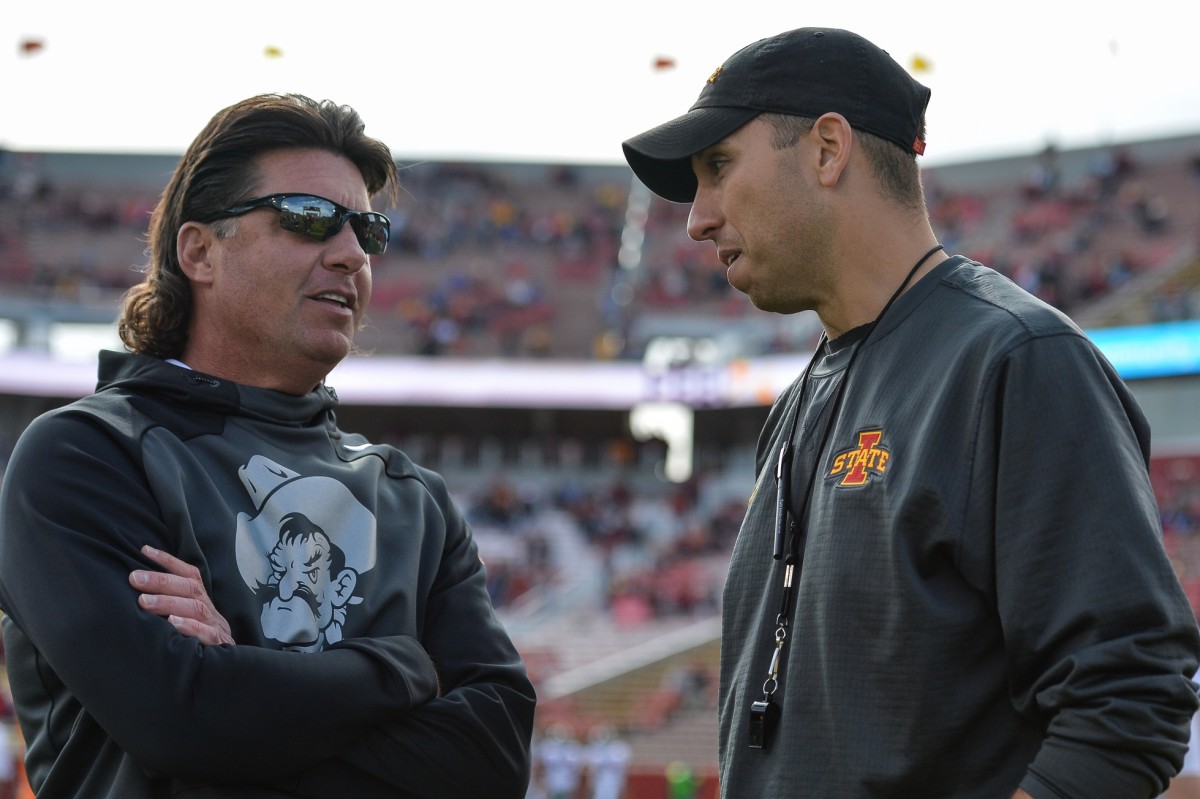 Mike Gundy and Matt Campbell talk about things before their two teams played in Ames, Iowa. A game the Cowboys won 34-27.