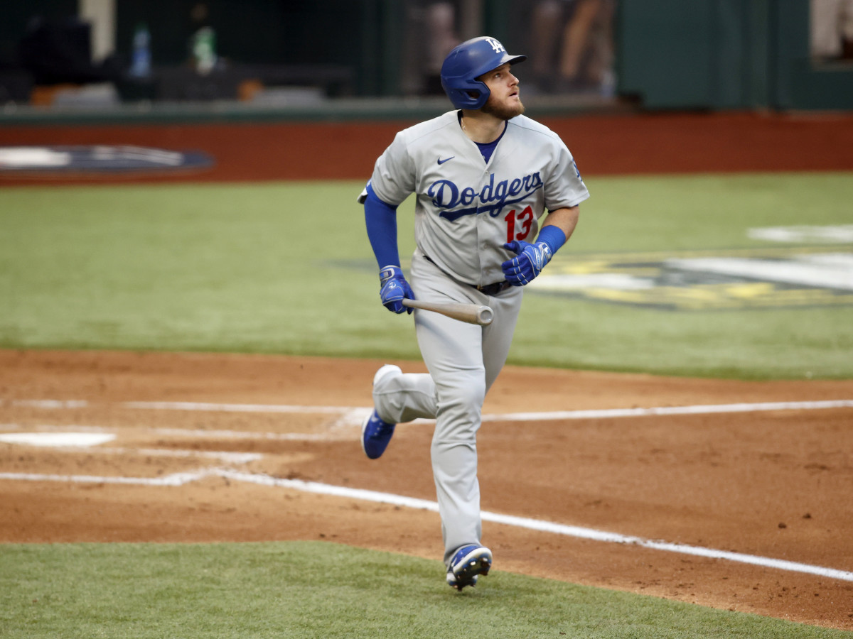 Oct 14, 2020; Arlington, Texas, USA; Los Angeles Dodgers first baseman Max Muncy (13) reacts after hitting a grand slam home run against the Atlanta Braves during the first inning of game three of the 2020 NLCS at Globe Life Field.