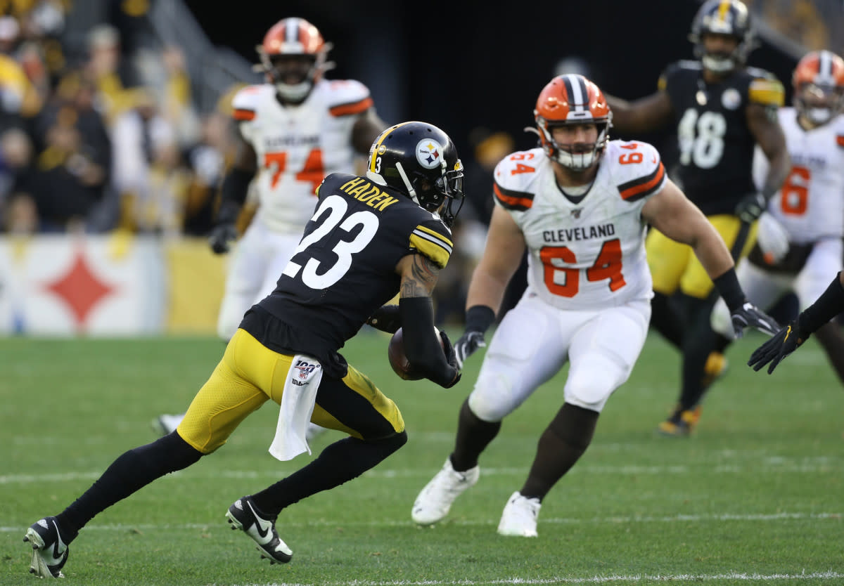 Steelers cornerback Joe Haden (23) runs with the ball after a game-clinching interception against the Browns during the fourth quarter at Heinz Field. 