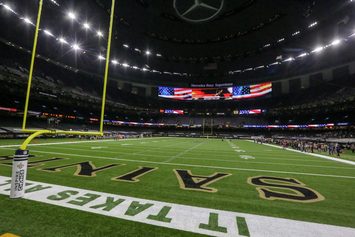 Sep 27, 2020; New Orleans, Louisiana, USA; A general view for the playing of the national anthem with the Green Bay Packers sideline empty prior to kickoff against the New Orleans Saints at the Mercedes-Benz Superdome. Man