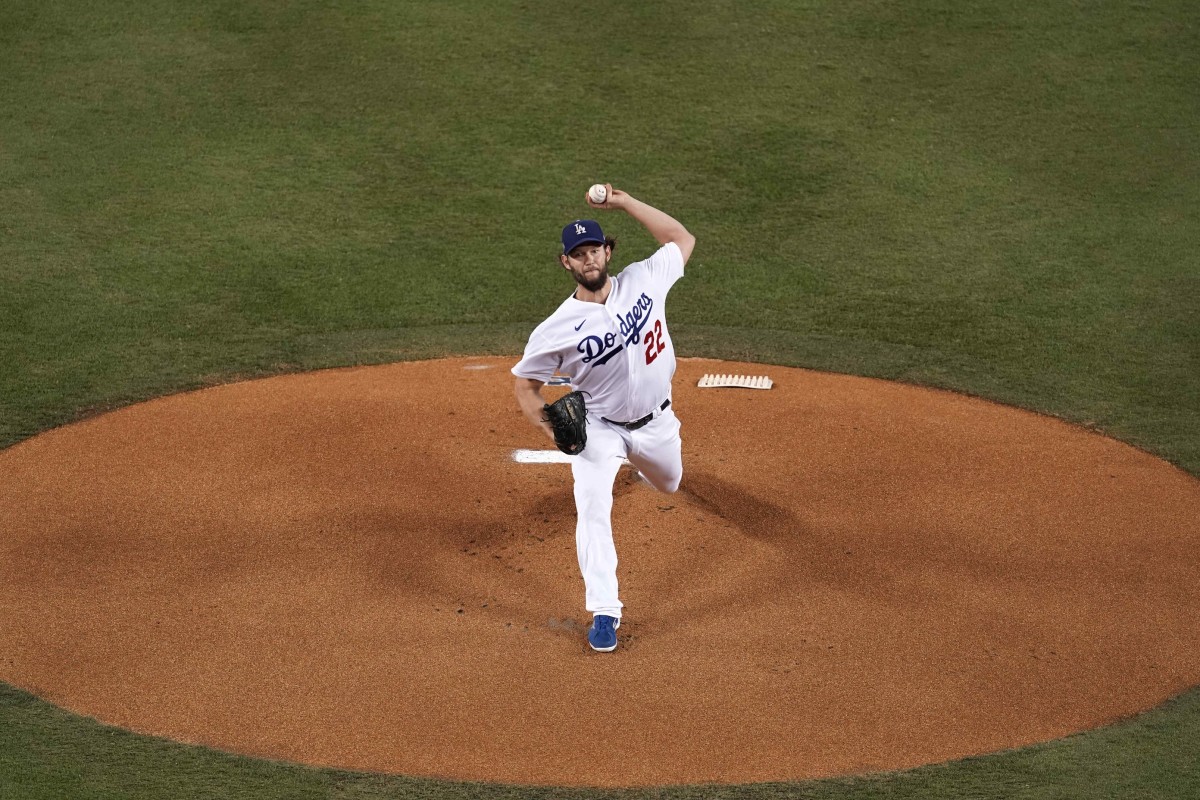 Oct 1, 2020; Los Angeles, California, USA; Los Angeles Dodgers starting pitcher Clayton Kershaw (22) delivers a pitch in the first inning against the Milwaukee Brewers during Game 2 of the National League Wild Card playoffs at Dodger Stadium. Mandatory Credit: Kirby Lee-USA TODAY Sports