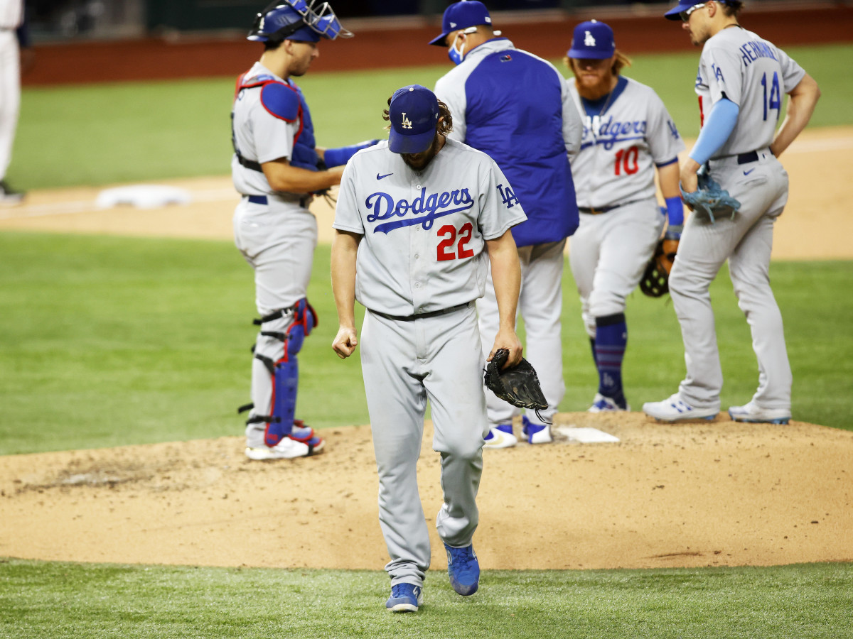 Oct 15, 2020; Arlington, Texas, USA; Los Angeles Dodgers starting pitcher Clayton Kershaw (22) walks to the dugout after being removed from the game during the sixth inning of game four of the 2020 NLCS against the Atlanta Braves at Globe Life Field.