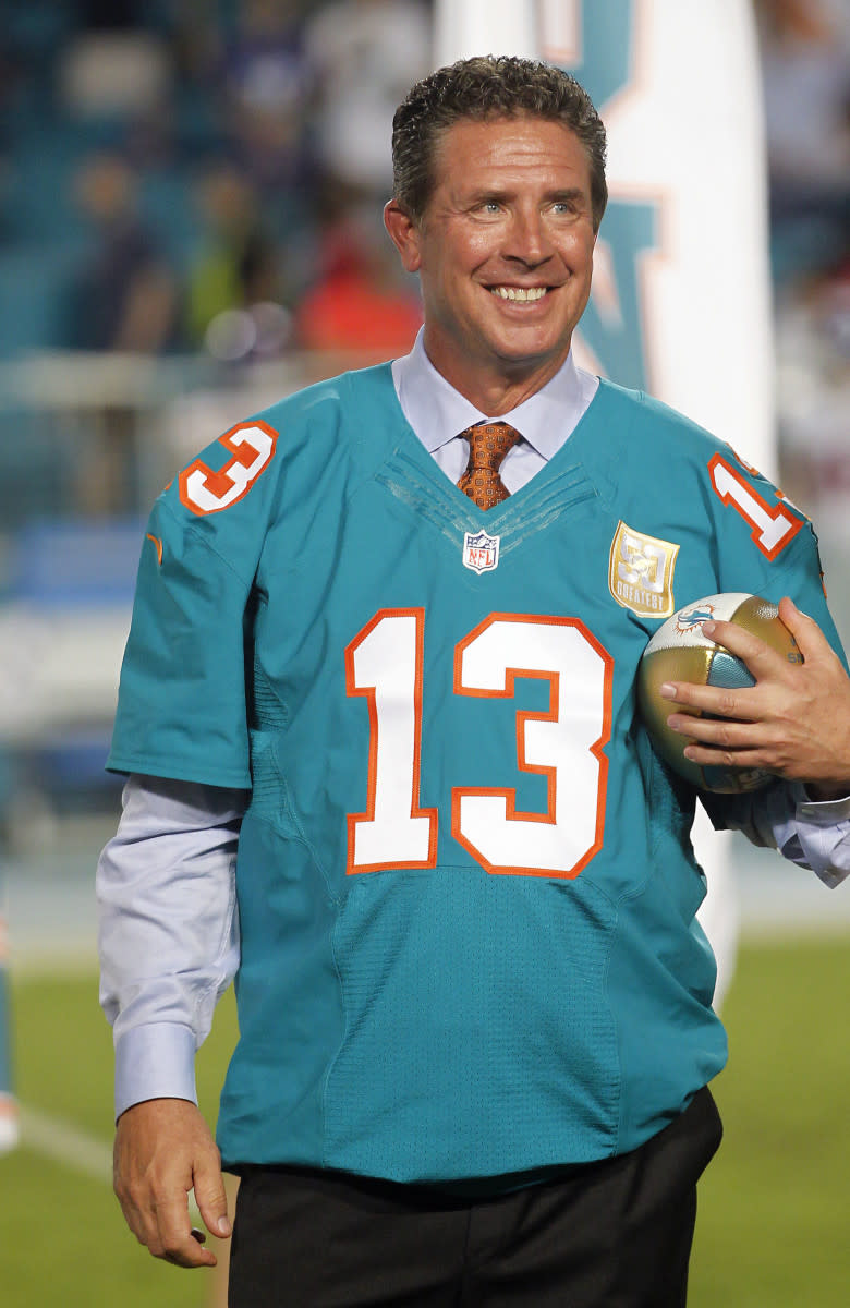Former Dolphins quarterback Dan Marino holds his commemorative ball during a halftime ceremony at Sun Life Stadium in 2015 after being named a member of the franchise's all-time team.