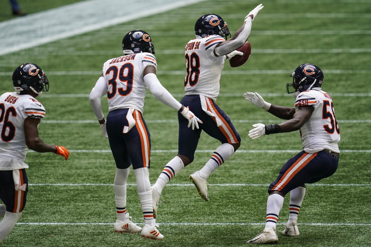 Bears defense celebrates after intercepting Matt Ryan late in the fourth quarter