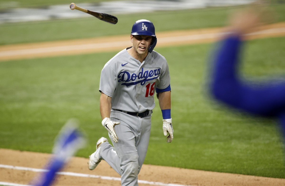 Oct 16, 2020; Arlington, Texas, USA; Los Angeles Dodgers catcher Will Smith (16) tosses his bat down the first baseline on his three run homerun against the Atlanta Braves during the sixth inning in game five of the 2020 NLCS at Globe Life Field. Mandatory Credit: Tim Heitman-USA TODAY Sports