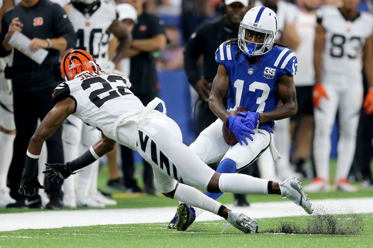 Indianapolis Colts wide receiver T.Y. Hilton (13) pins a ball for a reception as Cincinnati Bengals cornerback William Jackson (22) defends in the second quarter during the Week 1 NFL game between the Cincinnati Bengals and the Indianapolis Colts, Sunday, Sept. 9, 2018, at Lucas Oil Stadium in Indianapolis. Cincinnati Bengals Vs Indianapolis Colts Sept 9