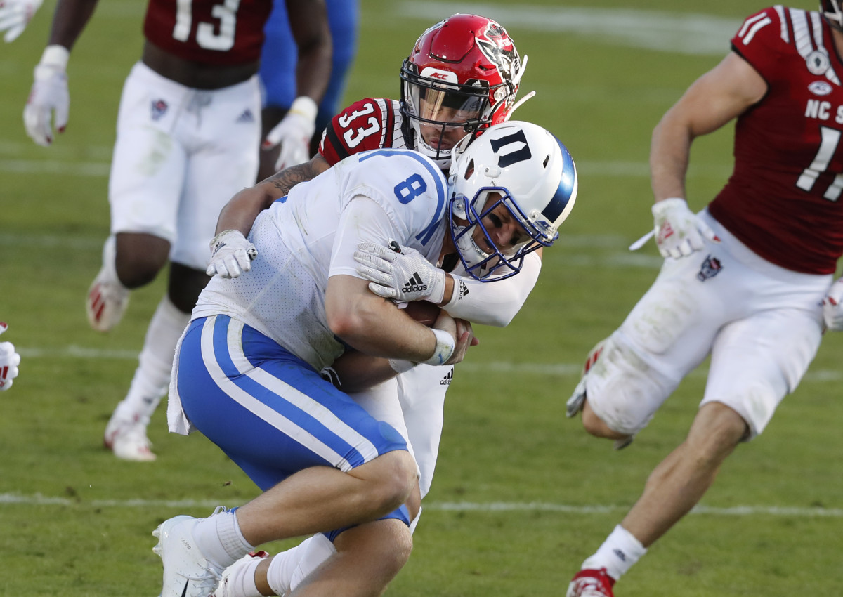Isaac Duffy makes a tackle on Duke quarterback Chase Brice
