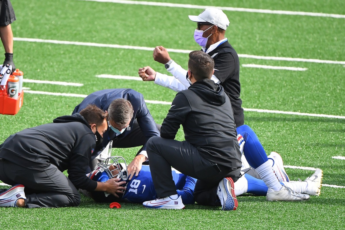 Oct 18, 2020; East Rutherford, New Jersey, USA; New York Giants wide receiver C.J. Board (18) is tended to by the medical staff after a hit against the Washington Football Team during the third quarter at MetLife Stadium.