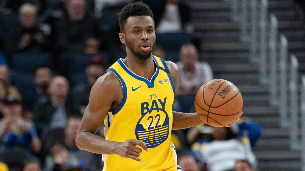 Golden State Warriors guard Andrew Wiggins dribbles the basketball