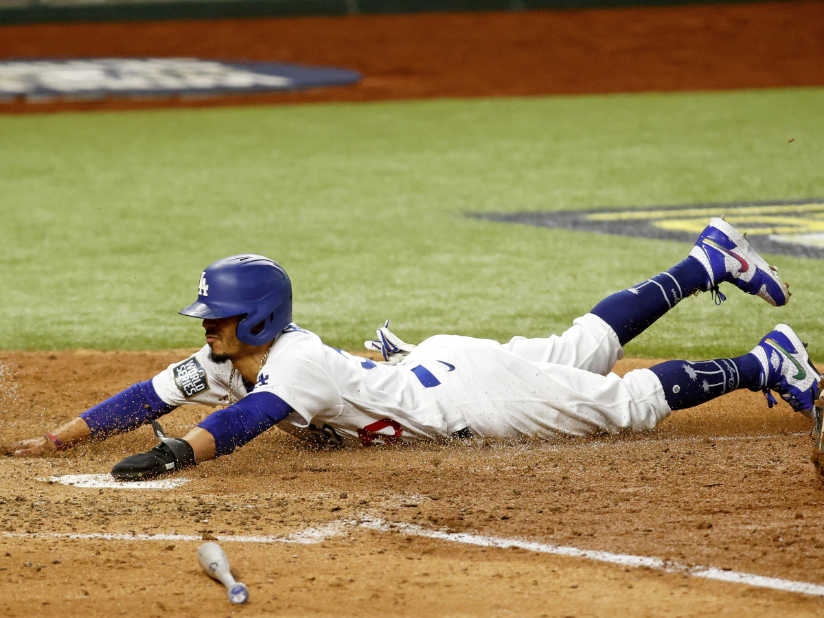 Oct 20, 2020; Arlington, Texas, USA; Los Angeles Dodgers right fielder Mookie Betts (50) scores a run in the 5th inning against the Tampa Bay Rays during game one of the 2020 World Series at Globe Life Field.
