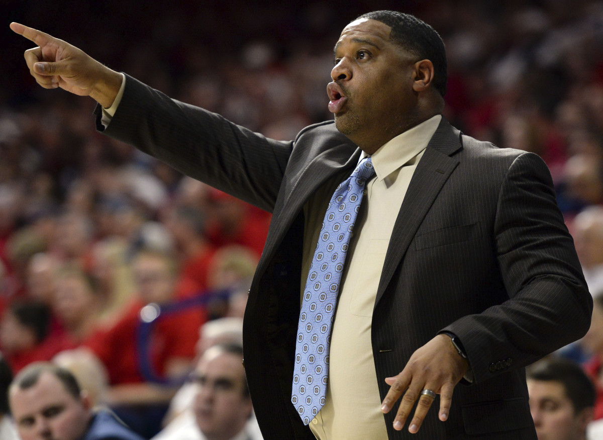 Arizona Wildcats assistant coach Book Richardson signals during the second half against the New Mexico Lobos at McKale Center. Arizona won 77-46.