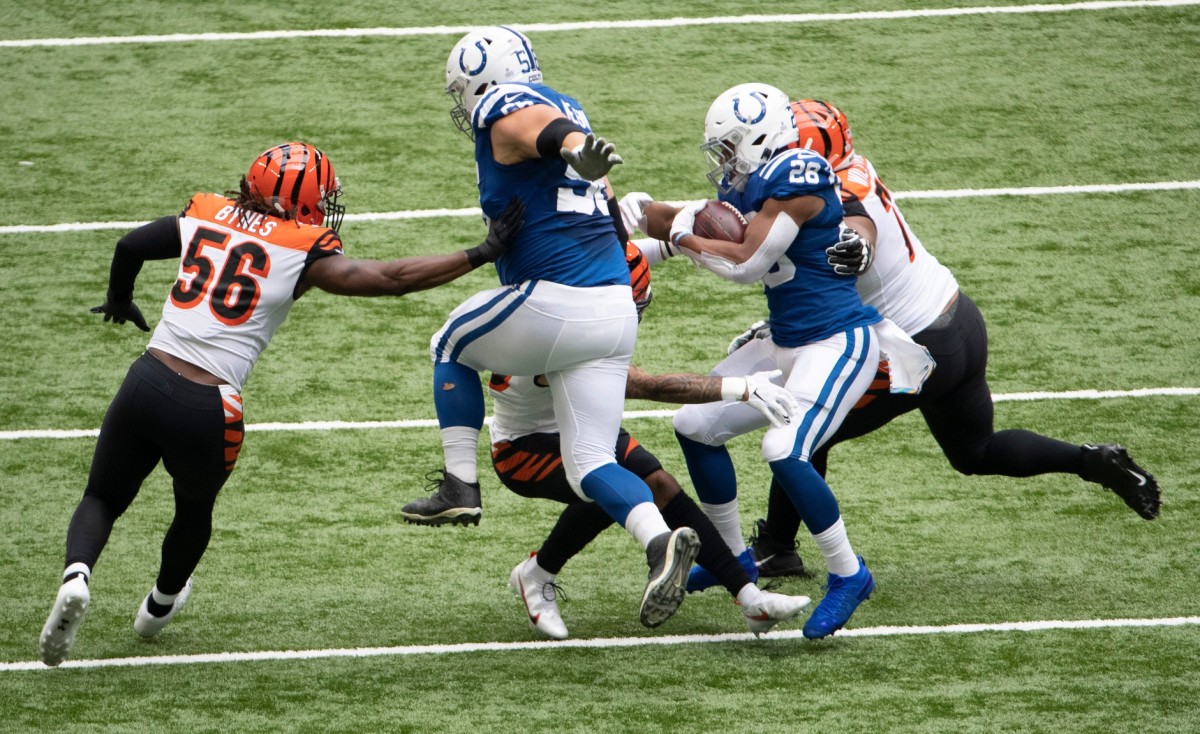 Indianapolis Colts offensive guard Quenton Nelson (56) jumps next to running back Jonathan Taylor (26) in Sunday's home win over the Cincinnati Bengals.