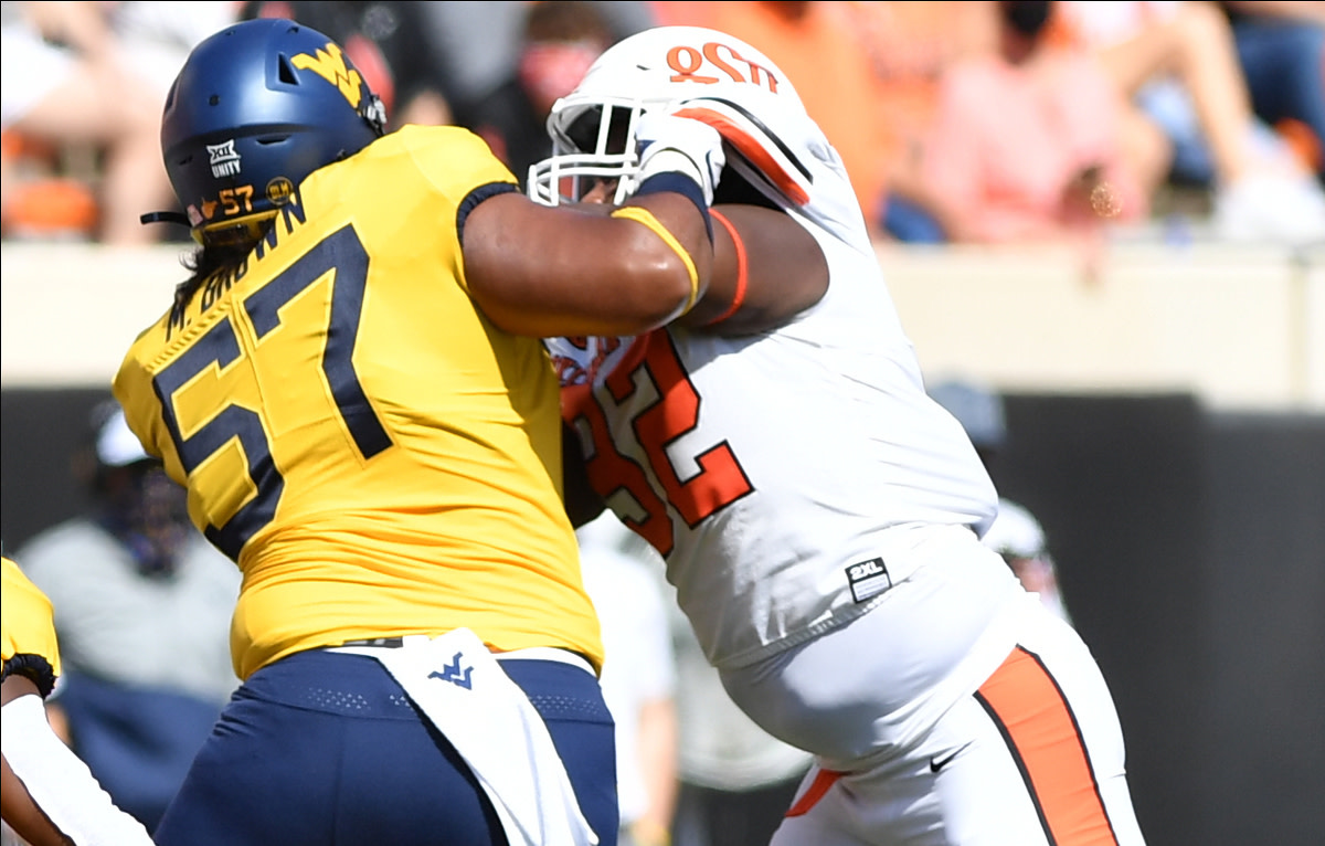Cameron Murray works to get off a block against West Virginia.