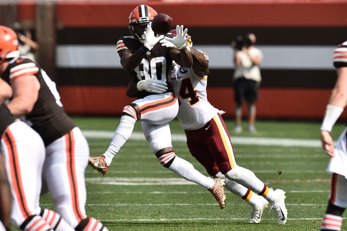 Sep 27, 2020; Cleveland, Ohio, USA; Cleveland Browns wide receiver Jarvis Landry (80) makes a catch in front of Washington Football Team outside linebacker Kevin Pierre-Louis (54) during the first half at FirstEnergy Stadium. Mandatory Credit: Ken Blaze-USA TODAY Sports