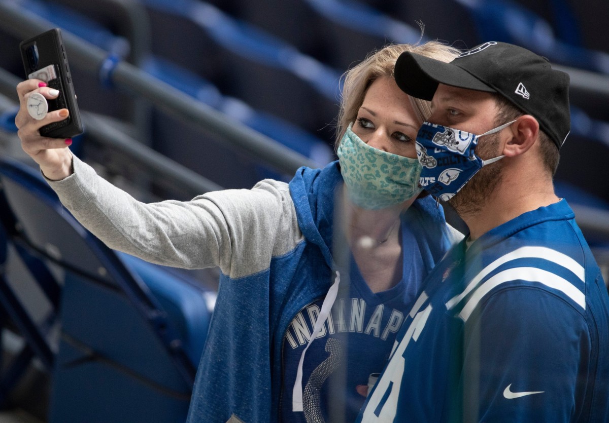 Two Indianapolis Colts fans take a selfie at Lucas Oil Stadium before Sunday's home game against the Cincinnati Bengals.