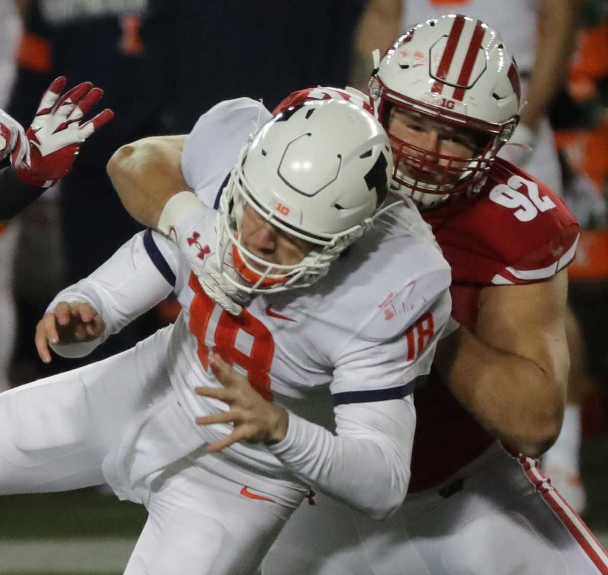 Wisconsin defensive end Matt Henningsen pressures Illinois quarterback Brandon Peters