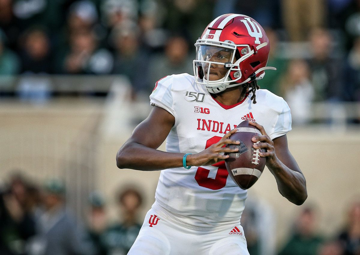 Indiana Hoosiers quarterback Michael Penix Jr. (9) drops back to throw the ball during the first half of a game against the Michigan State Spartans at Spartan Stadium.