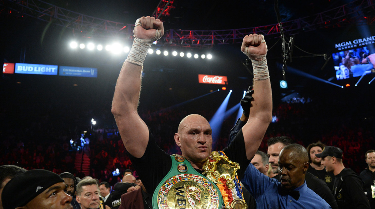 Tyson Fury celebrates his win over Deontay Wilder