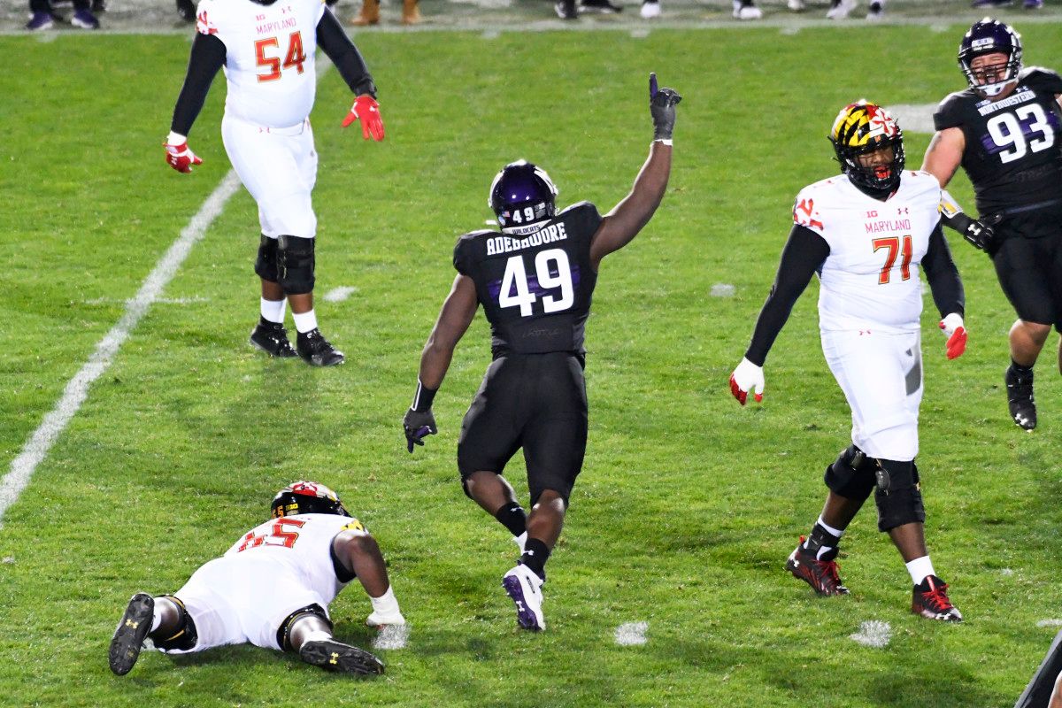 Adetomiwa Adebawore celebrates after making a sack.