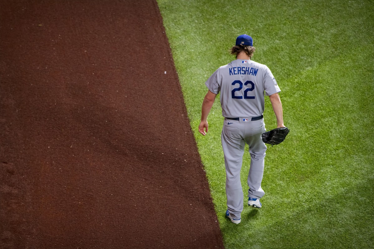 Oct 25, 2020; Arlington, Texas, USA; Los Angeles Dodgers starting pitcher Clayton Kershaw (22) warms up before the game between the Tampa Bay Rays and the Los Angeles Dodgers in game five of the 2020 World Series at Globe Life Field. Mandatory Credit: Jerome Miron-USA TODAY Sports