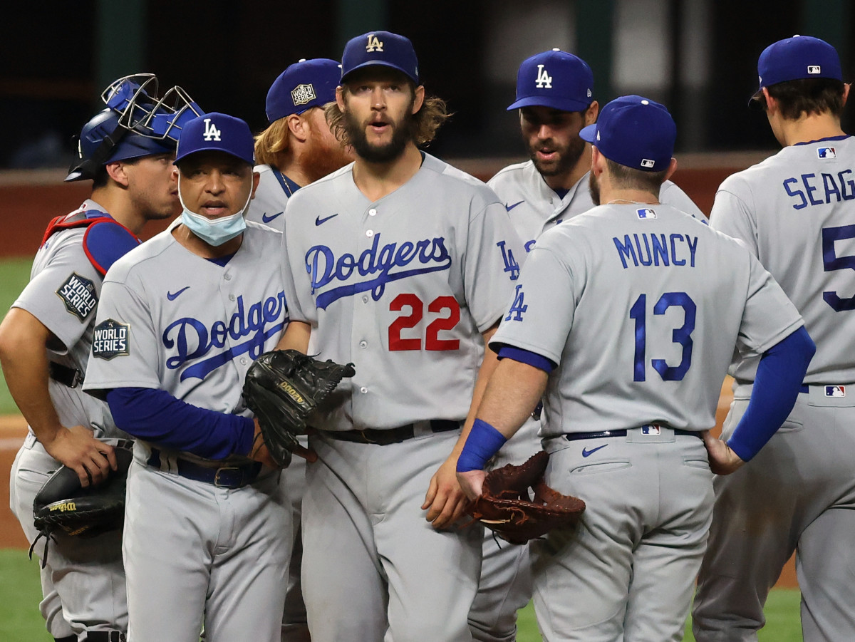 Los Angeles Dodgers manager Dave Roberts (30) takes starting pitcher Clayton Kershaw (22) out of the game during the sixth inning during game five of the 2020 World Series at Globe Life Field.