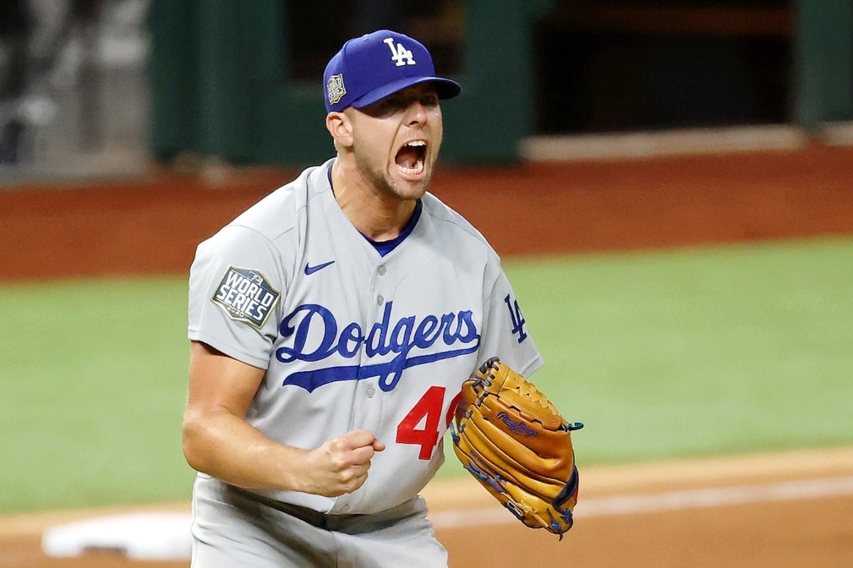 Oct 25, 2020; Arlington, Texas, USA; Los Angeles Dodgers relief pitcher Blake Treinen (49) reacts after striking out Tampa Bay Rays shortstop Willy Adames (not pictured) to end the ninth inning of game five of the 2020 World Series at Globe Life Field. The Los Angeles Dodgers won 4-2. Mandatory Credit: Kevin Jairaj-USA TODAY Sports