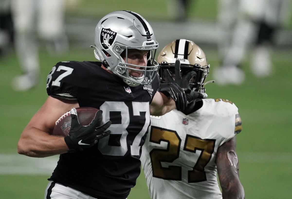 Sep 21, 2020; Paradise, Nevada, USA; Las Vegas Raiders tight end Foster Moreau (87) stiff arms New Orleans Saints strong safety Malcolm Jenkins (27) during the third quarter of a NFL game at Allegiant Stadium. Mandatory Credit: Kirby Lee-USA TODAY