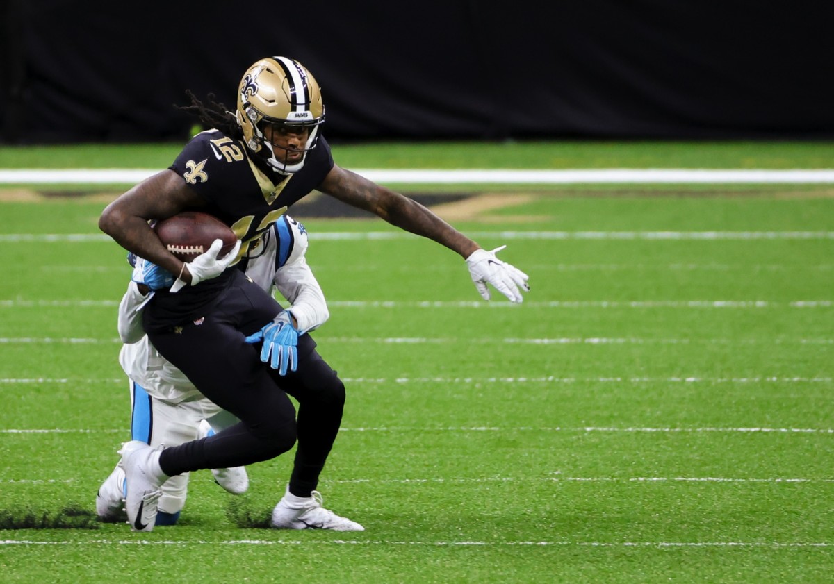 Oct 25, 2020; New Orleans, Louisiana, USA; New Orleans Saints wide receiver Marquez Callaway (12) is tackled by Carolina Panthers running back Jordan Scarlett (20) during the second half at the Mercedes-Benz Superdome. Mandatory Credit: Derick E. Hingle-USA TODAY