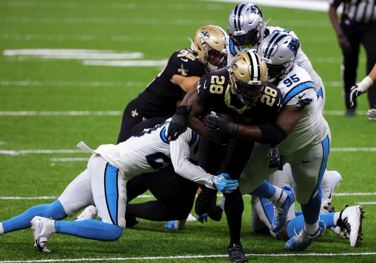 Oct 25, 2020; New Orleans, Louisiana, USA; New Orleans Saints running back Latavius Murray (28) is tackled by Carolina Panthers defensive tackle Derrick Brown (95) during the second half at the Mercedes-Benz Superdome. Mandatory Credit: Derick E. Hingle-USA TODAY 