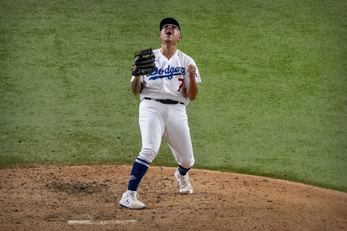 Oct 27, 2020; Arlington, Texas, USA; Los Angeles Dodgers relief pitcher Julio Urias (7) celebrates defeating the Tampa Bay Rays in game six of the 2020 World Series at Globe Life Field. Mandatory Credit: Jerome Miron-USA TODAY Sports