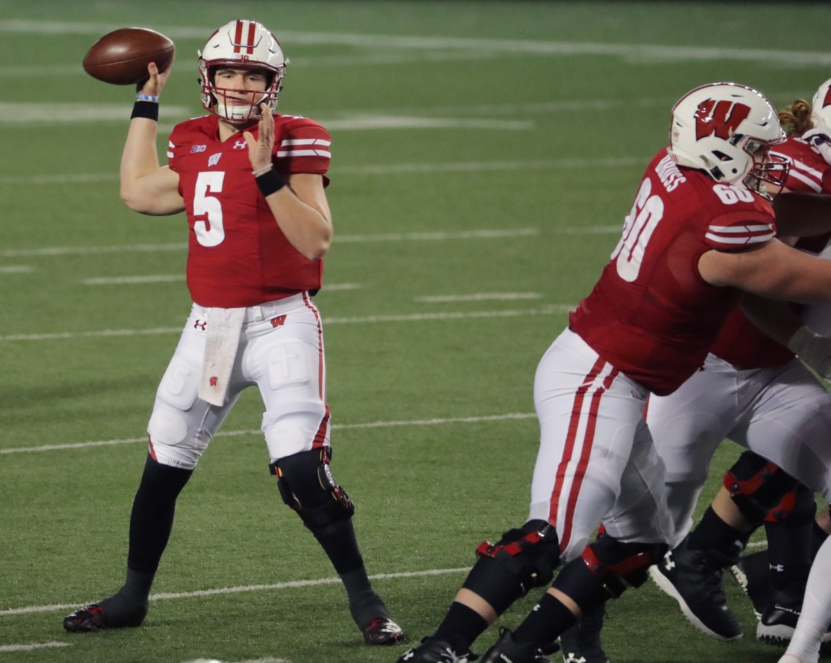 Wisconsin quarterback Graham Mertz looks and completes one of his 20 completed passes Friday night. Mertz only threw one incompletion and threw four of his five touchdowns in the first half in Wisconsin's opening victory over Illinois,
